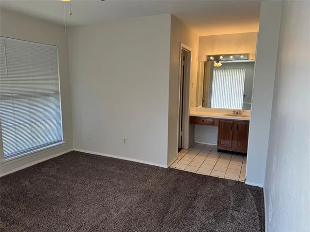 a bathroom with a sink and mirror