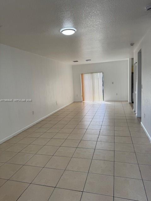 28107 Southwest 143rd Court, Unit 28107 Homestead, FL 33033 - Photo 4 of 10 an empty room with windows