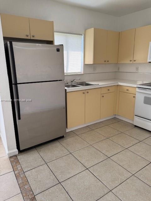 28107 Southwest 143rd Court, Unit 28107 Homestead, FL 33033 - Photo 5 of 10 a utility room with cabinets washer and dryer