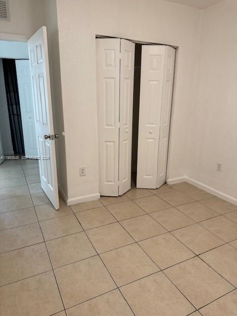 28107 Southwest 143rd Court, Unit 28107 Homestead, FL 33033 - Photo 7 of 10 an empty room with wooden floor
