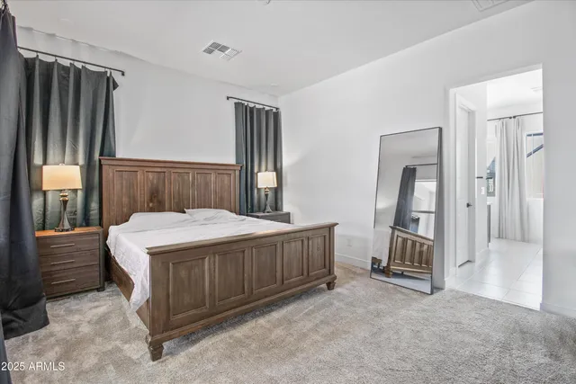 a bed sitting in a room next to a window