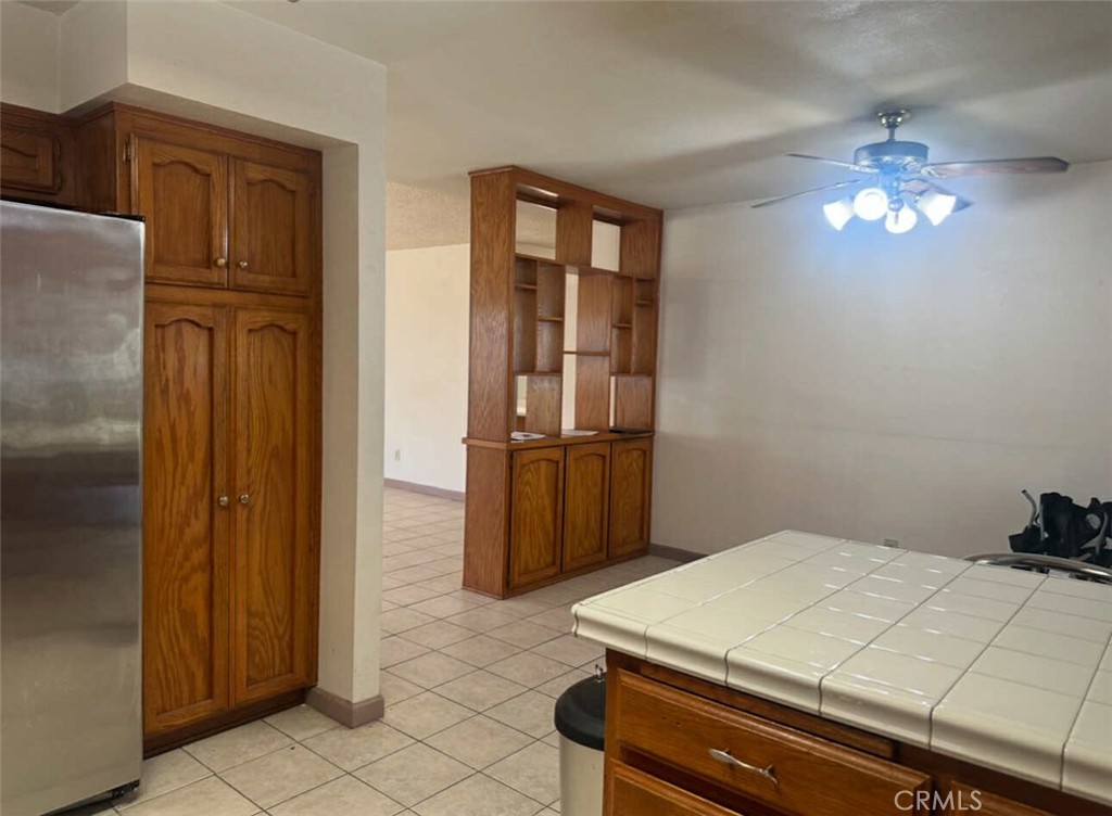 725 18th Place Delano, CA 93215 - Photo 17 of 36 a room with pool table and chandelier