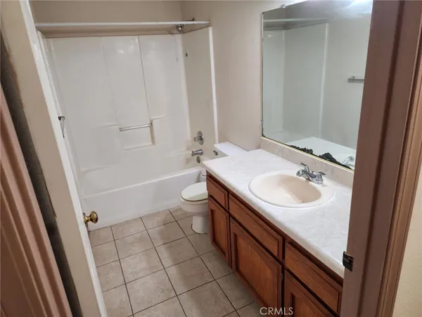 a bathroom with a sink a toilet and a shower