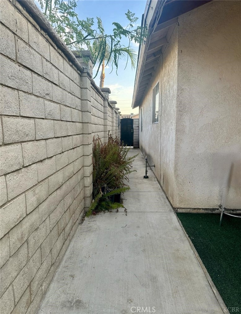 725 18th Place Delano, CA 93215 - Photo 6 of 36 a view of a pathway with a yard