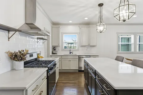 a kitchen with a sink and stove