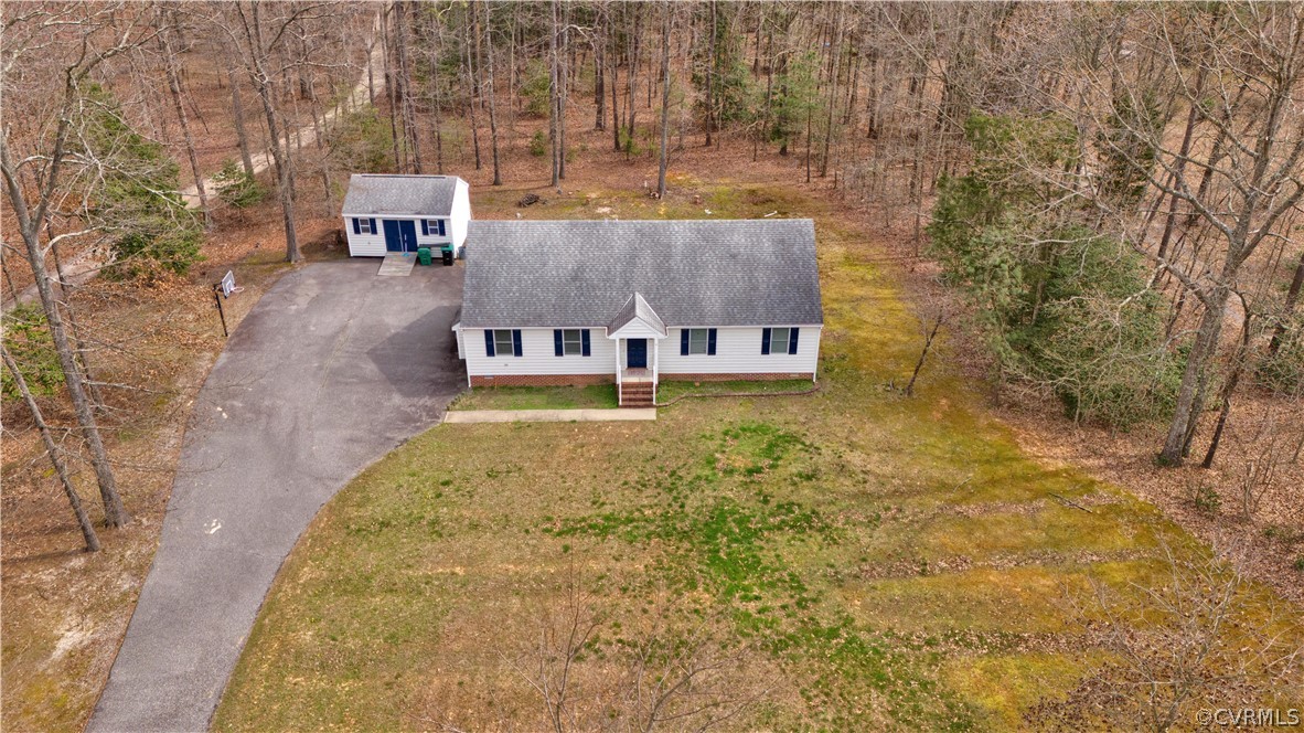8561 Roundabout Road Henrico, VA 23231 - Photo 15 of 42 a view of a back yard with an outdoor space