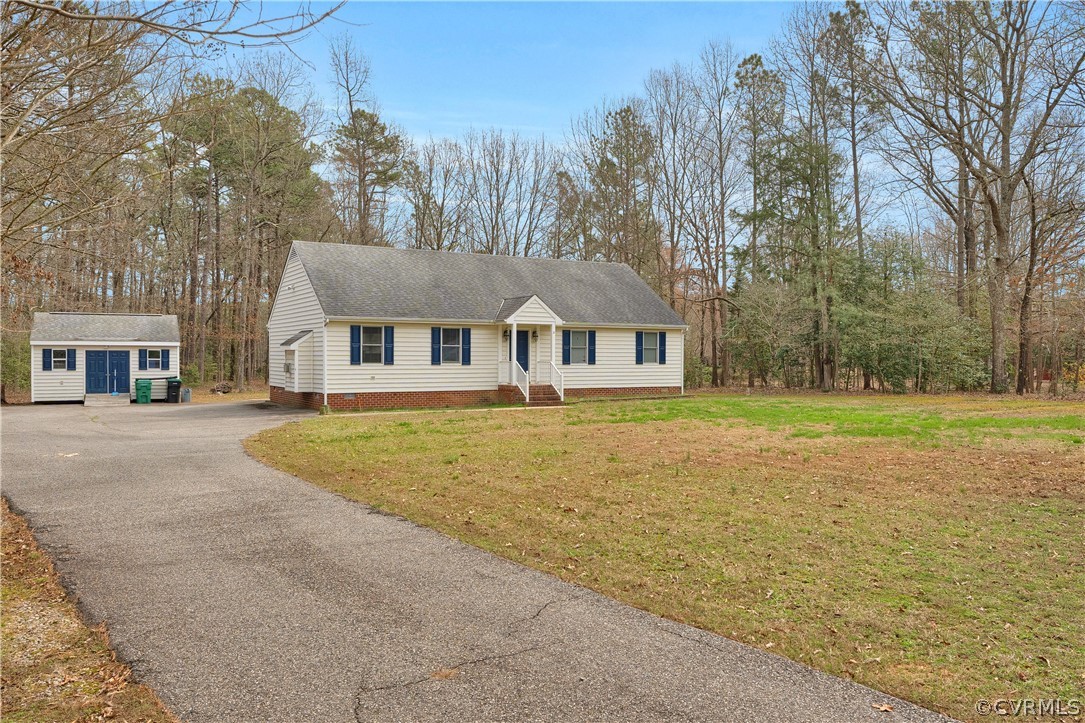 8561 Roundabout Road Henrico, VA 23231 - Photo 17 of 42 a front view of a house with swimming pool