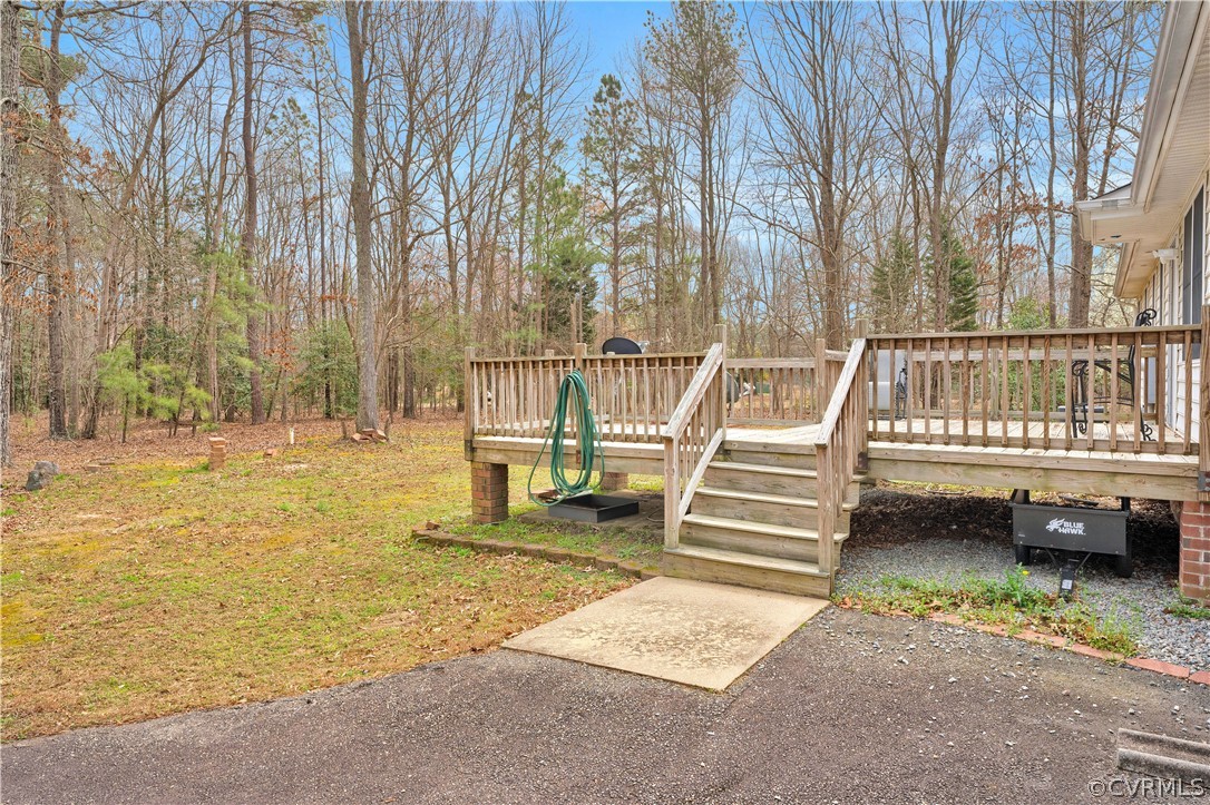 8561 Roundabout Road Henrico, VA 23231 - Photo 19 of 42 a view of a swimming pool with a bench and trees