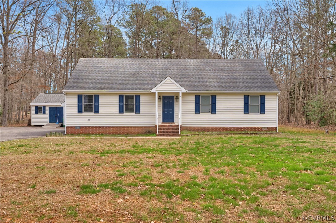 8561 Roundabout Road Henrico, VA 23231 - Photo 2 of 42 front view of a house with a yard