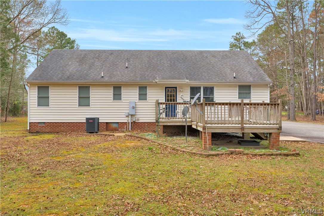 8561 Roundabout Road Henrico, VA 23231 - Photo 21 of 42 a backyard of a house with barbeque oven and outdoor seating