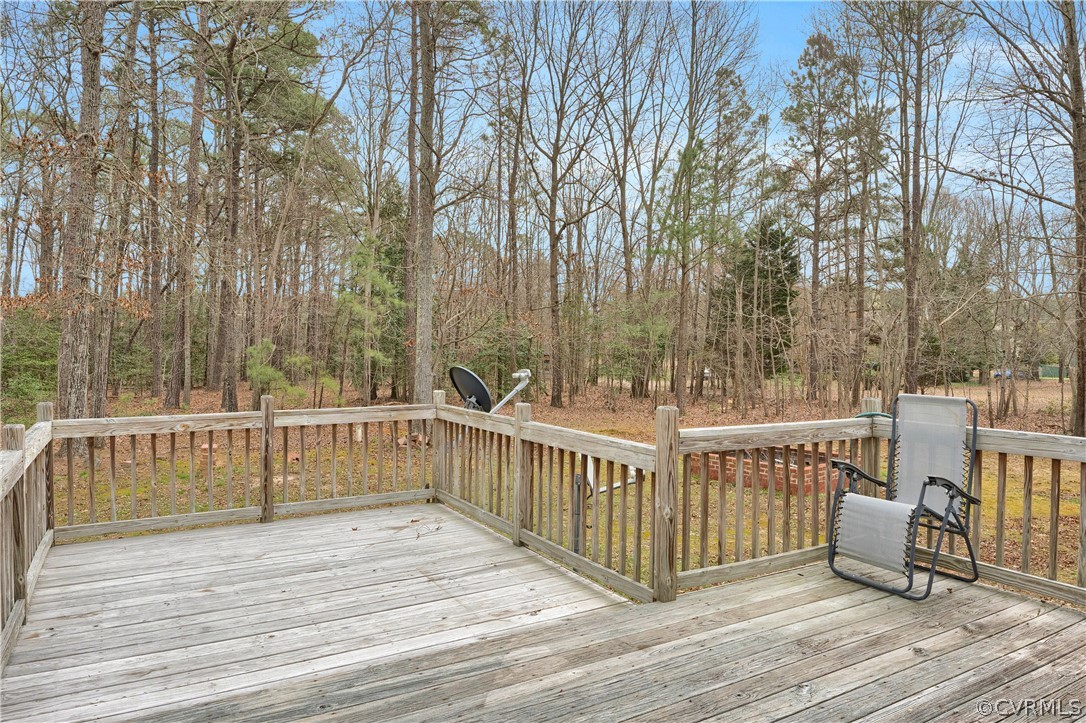 8561 Roundabout Road Henrico, VA 23231 - Photo 22 of 42 a view of a deck with chairs and wooden fence