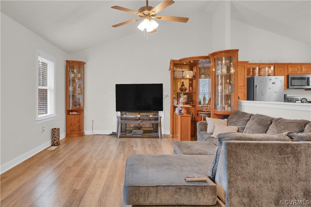 8561 Roundabout Road Henrico, VA 23231 - Photo 24 of 42 a living room with furniture and a flat screen tv
