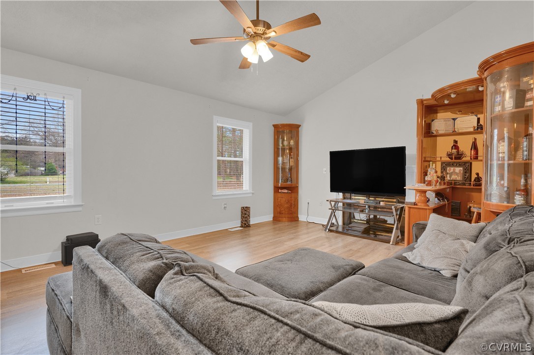 8561 Roundabout Road Henrico, VA 23231 - Photo 26 of 42 a living room with furniture and a flat screen tv
