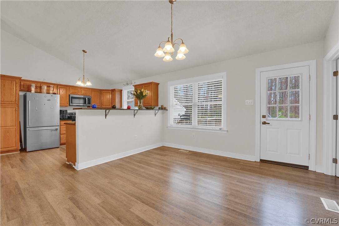 8561 Roundabout Road Henrico, VA 23231 - Photo 29 of 42 a view of a kitchen with a sink oven window and wooden floor