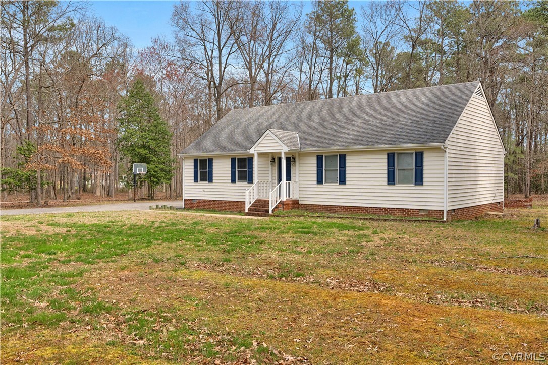 8561 Roundabout Road Henrico, VA 23231 - Photo 3 of 42 a front view of a house with garden