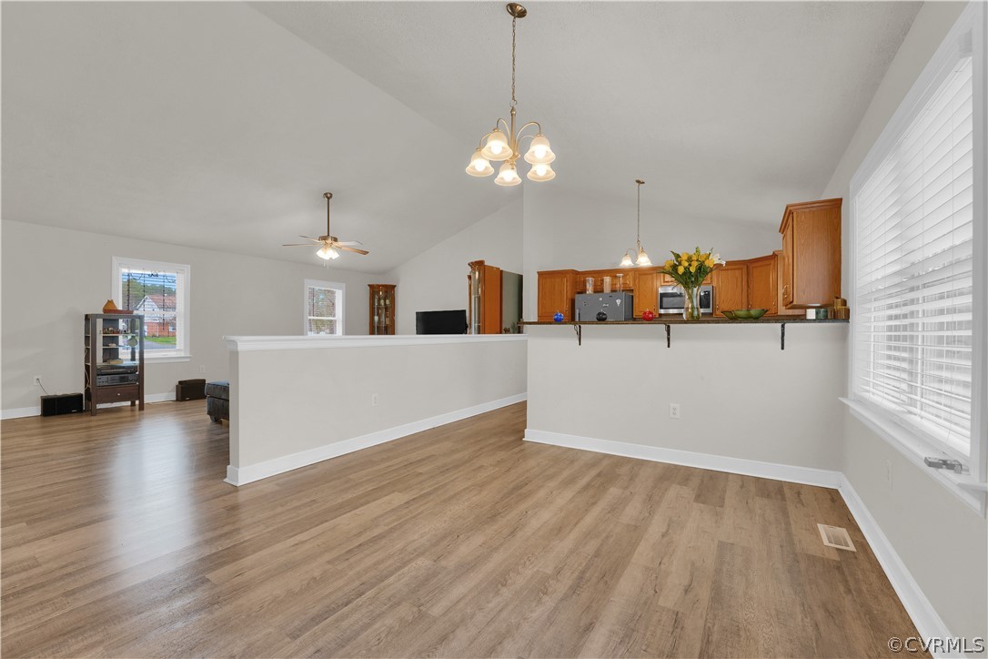 8561 Roundabout Road Henrico, VA 23231 - Photo 31 of 42 a view of a kitchen with wooden floor and a chandelier