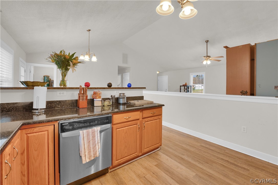 8561 Roundabout Road Henrico, VA 23231 - Photo 34 of 42 a kitchen with kitchen island granite countertop a sink cabinets and wooden floor
