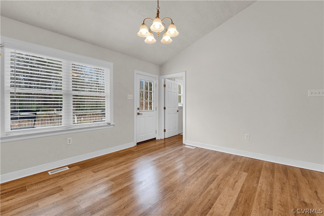 8561 Roundabout Road Henrico, VA 23231 - Photo 35 of 42 a view of wooden floor and a chandelier fan in a room