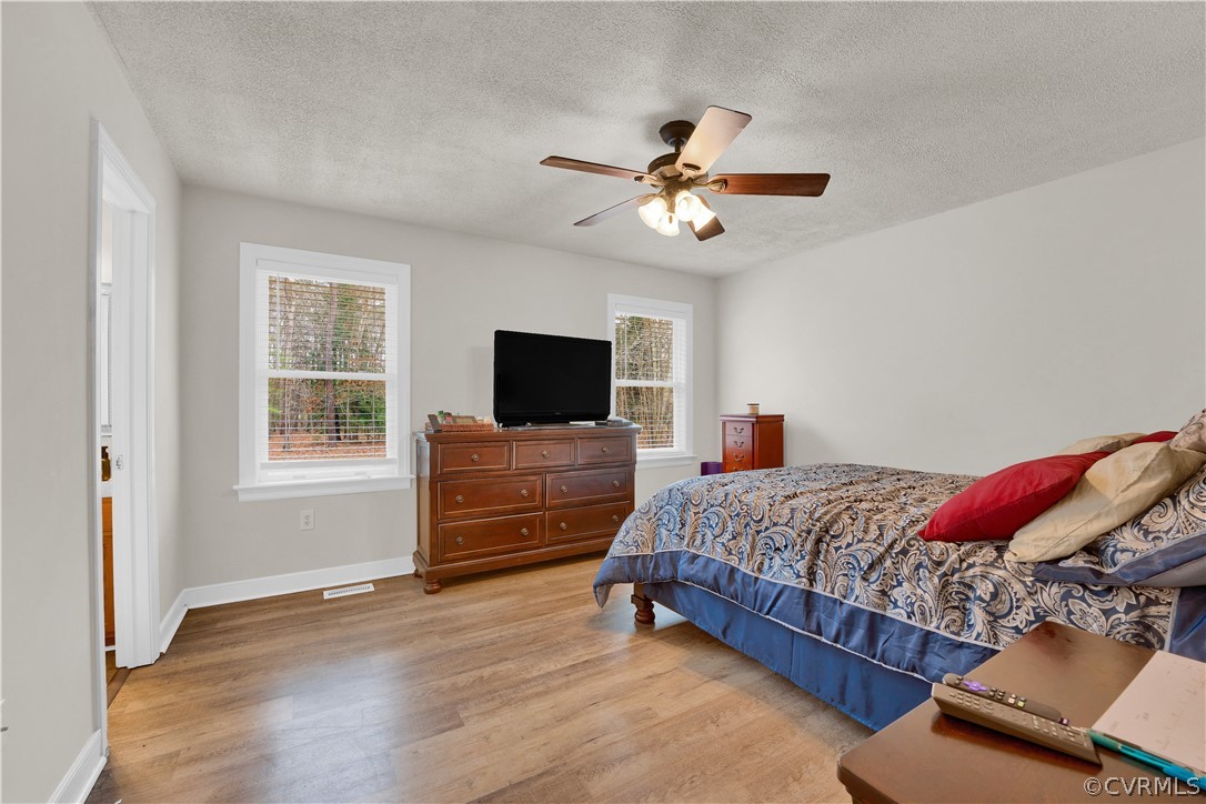 8561 Roundabout Road Henrico, VA 23231 - Photo 38 of 42 a bedroom with a bed and a flat screen tv