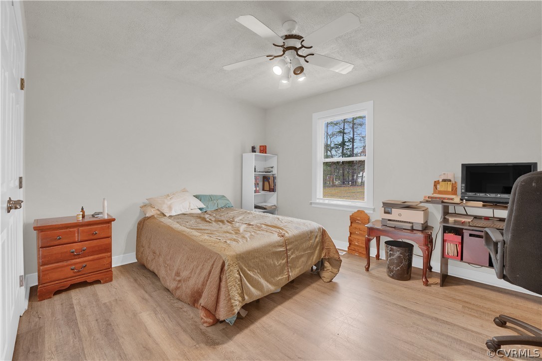 8561 Roundabout Road Henrico, VA 23231 - Photo 40 of 42 a bedroom with a bed and a flat screen tv