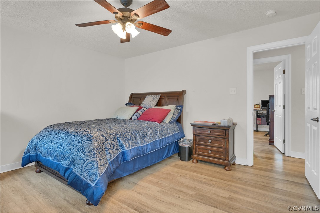8561 Roundabout Road Henrico, VA 23231 - Photo 41 of 42 a bedroom with a bed and cabinets