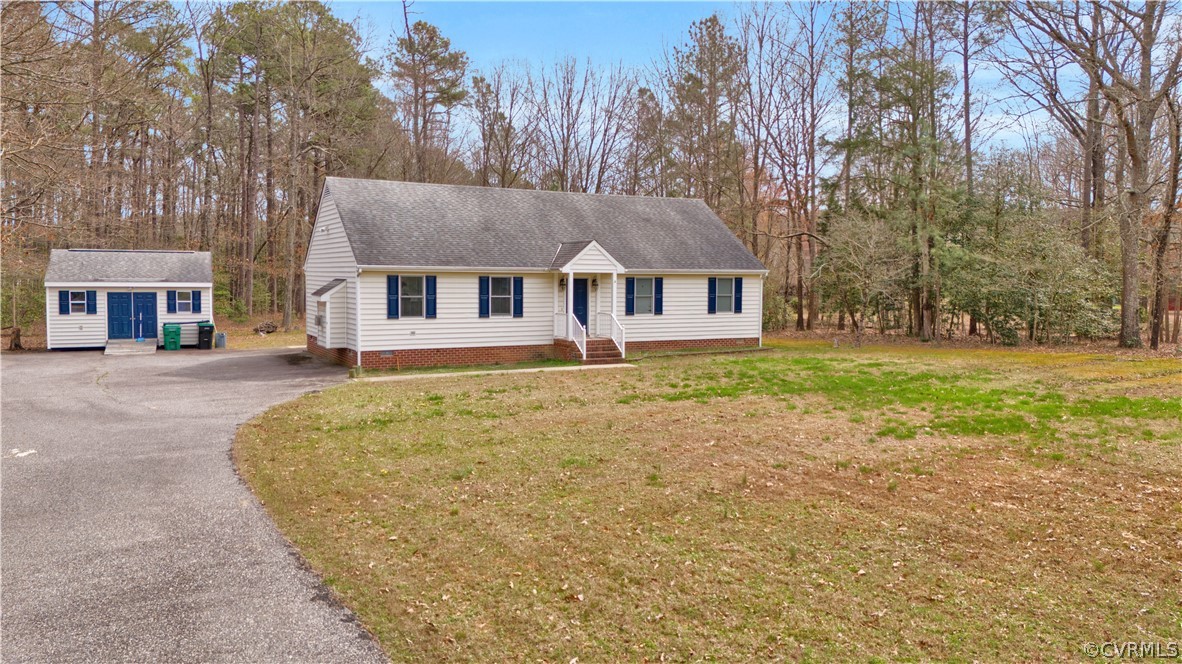 8561 Roundabout Road Henrico, VA 23231 - Photo 5 of 42 front view of a house with a yard