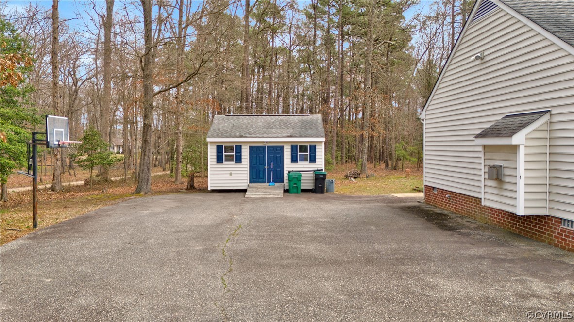 8561 Roundabout Road Henrico, VA 23231 - Photo 7 of 42 a view of a house with a backyard and tree