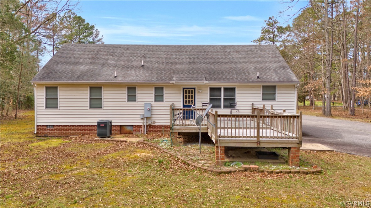8561 Roundabout Road Henrico, VA 23231 - Photo 9 of 42 a front view of a house with a deck and furniture