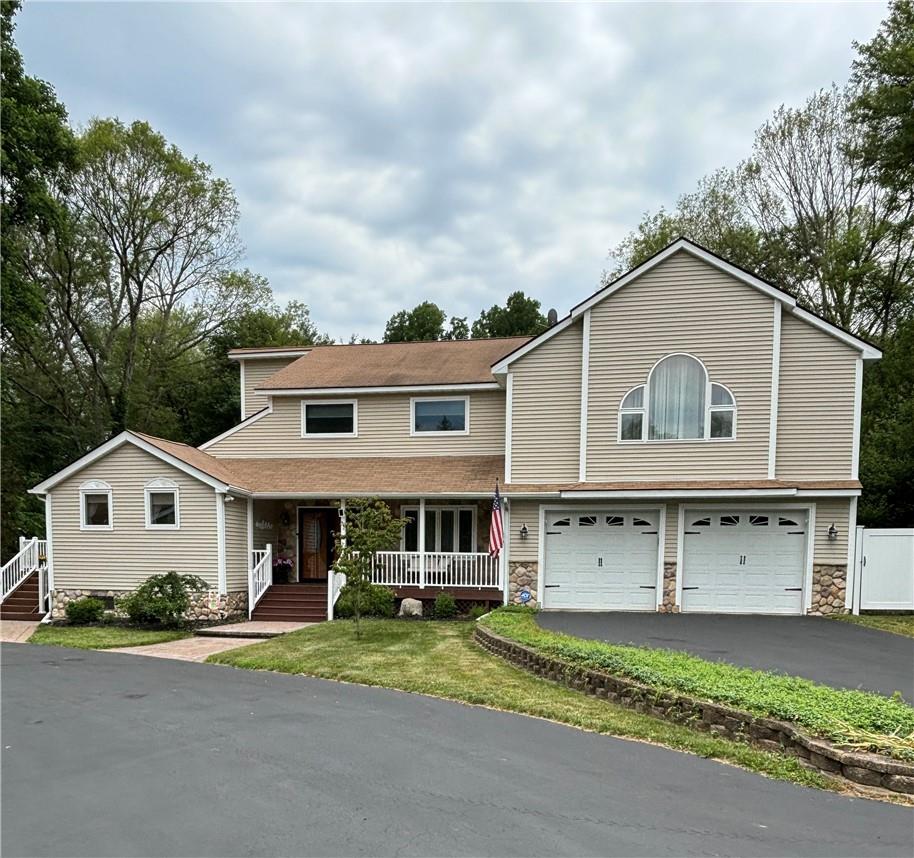 32 Hamilton Road Hopewell Junction, NY 12533 - Photo 1 of 1 View of front of house featuring a garage and a porch