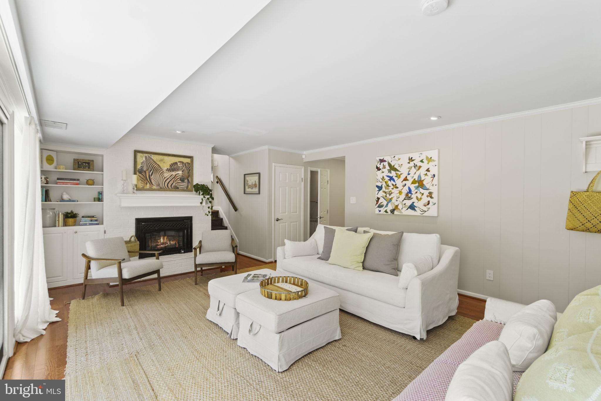 309 Halsey Road Annapolis, MD 21401 - Photo 12 of 44 Room is anchored by brick fireplace and built-ins