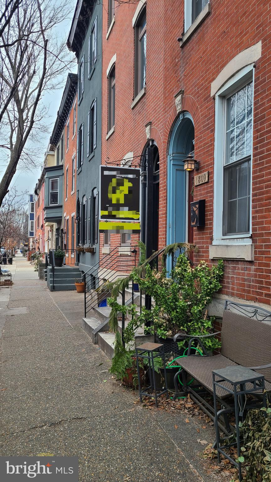a view of a building with sitting area