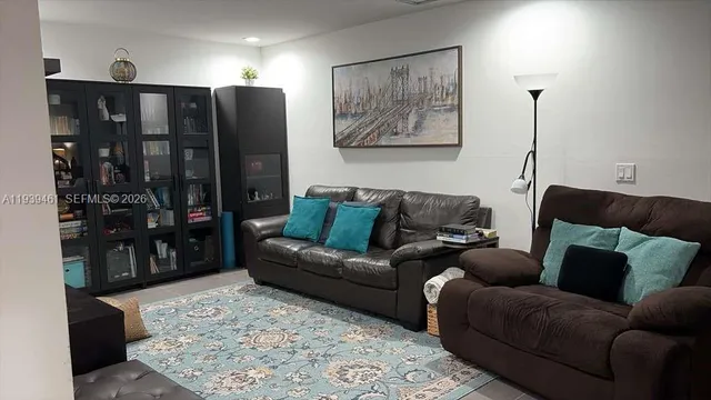 a living room with furniture and a couch