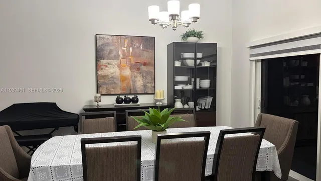 a dining room with furniture and window