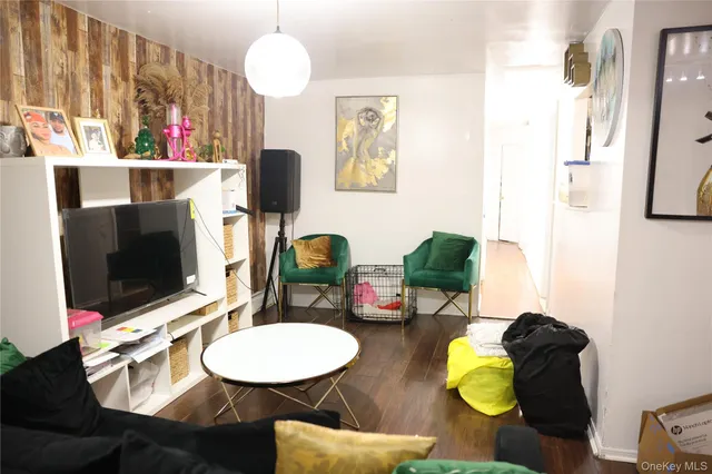 a room with furniture and a flat screen tv