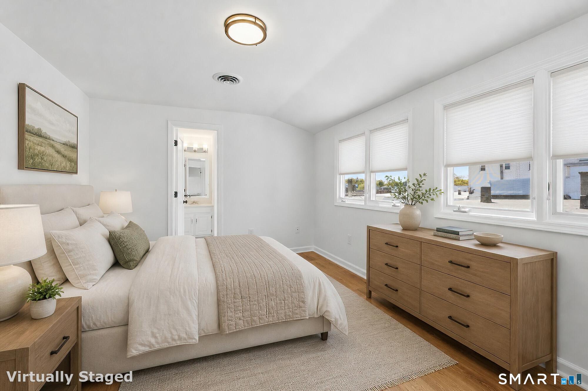 426 Main Street, Unit G Ridgefield, CT 06877 - Photo 12 of 24 a bedroom with a bed and a dresser