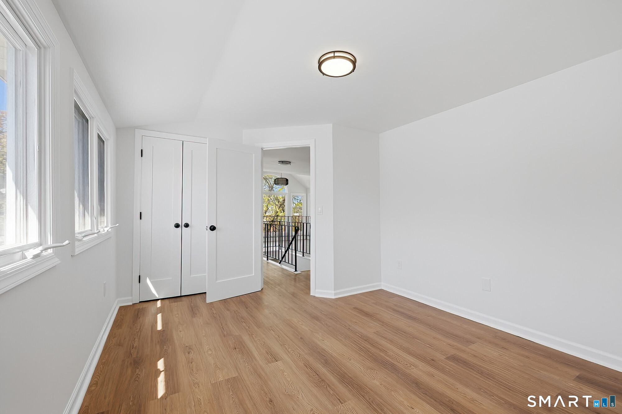 426 Main Street, Unit G Ridgefield, CT 06877 - Photo 14 of 24 a view of a room with wooden floor and entryway