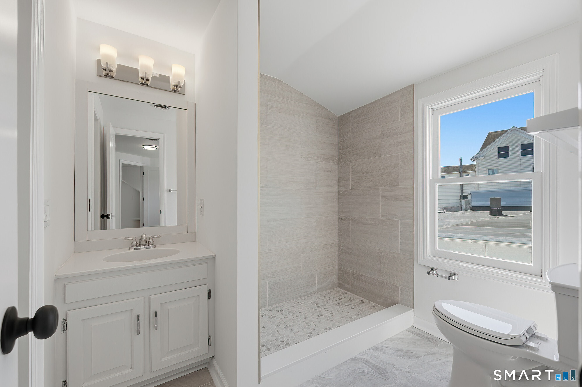 426 Main Street, Unit G Ridgefield, CT 06877 - Photo 15 of 24 a bathroom with a sink a toilet and shower