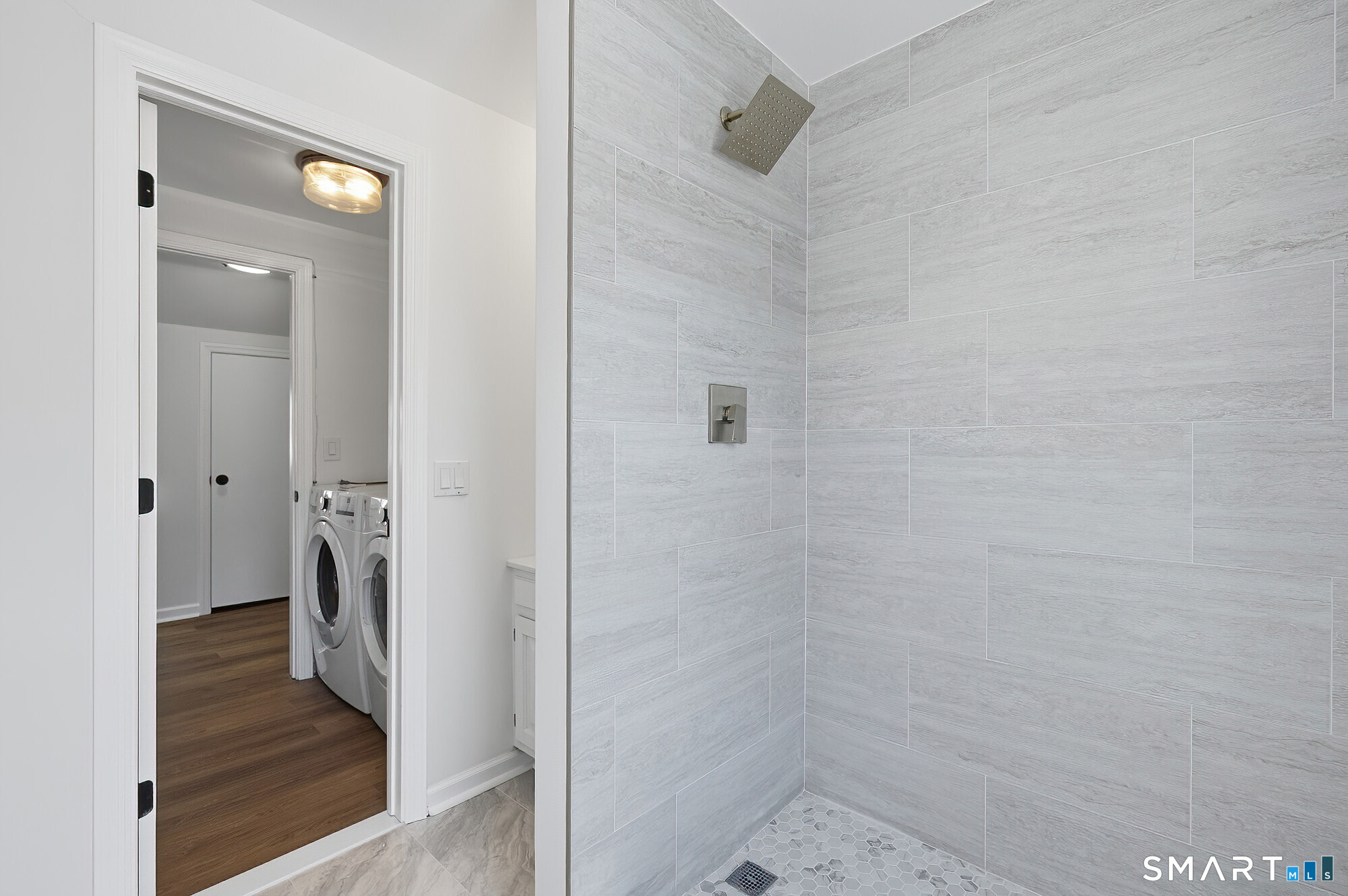 426 Main Street, Unit G Ridgefield, CT 06877 - Photo 16 of 24 a bathroom with a shower