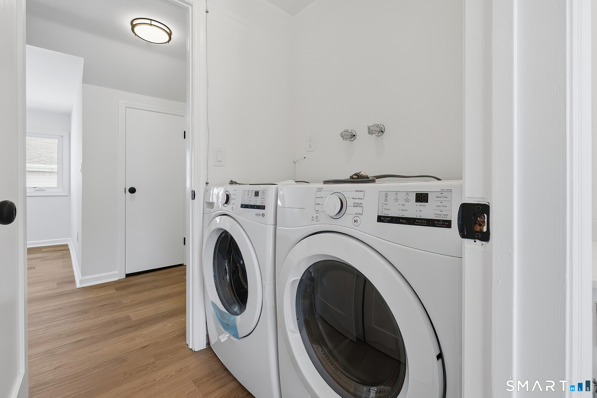 426 Main Street, Unit G Ridgefield, CT 06877 - Photo 17 of 24 a utility room with dryer and washer