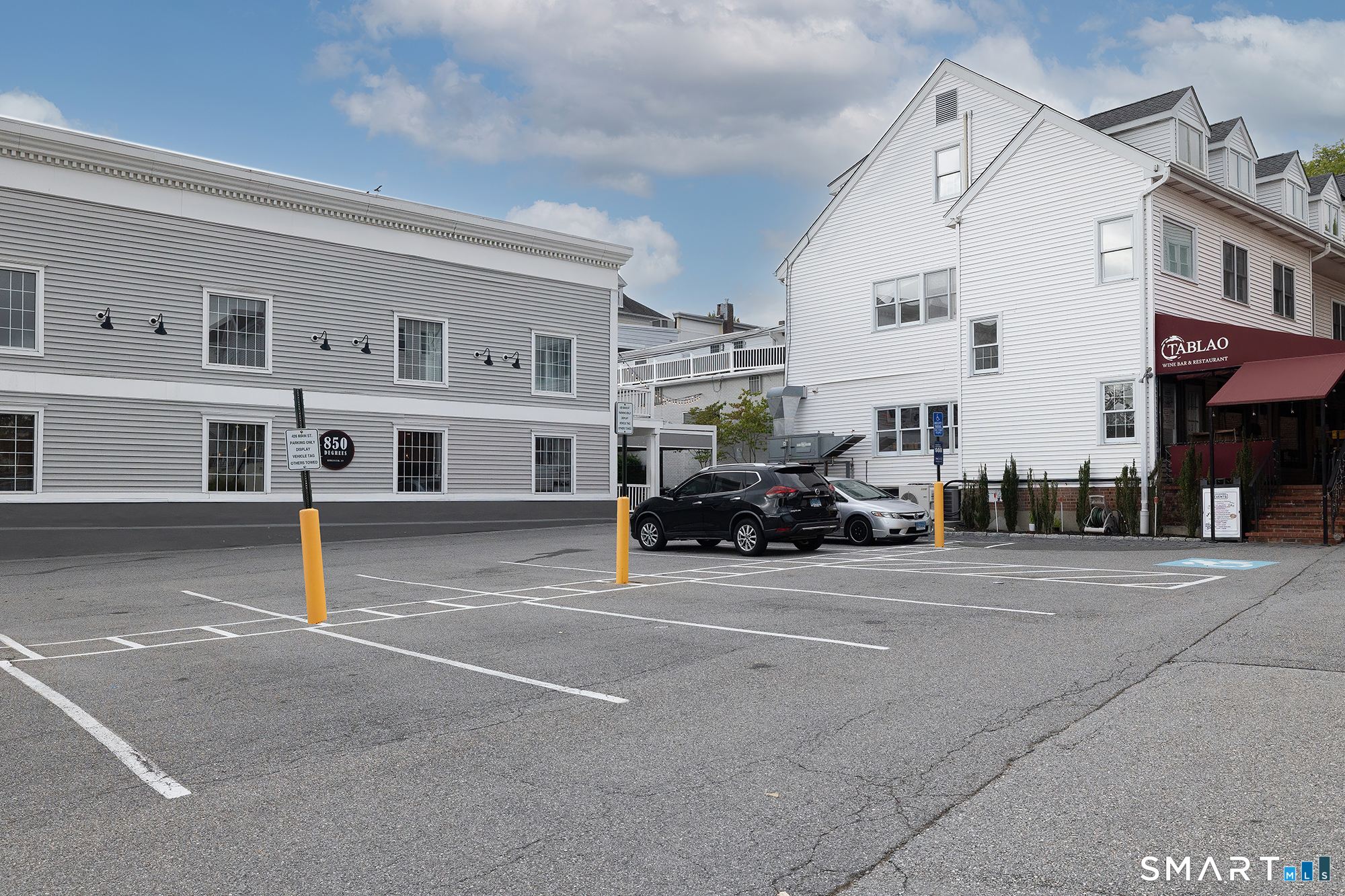 426 Main Street, Unit G Ridgefield, CT 06877 - Photo 22 of 24 a view of a car park in front of a building