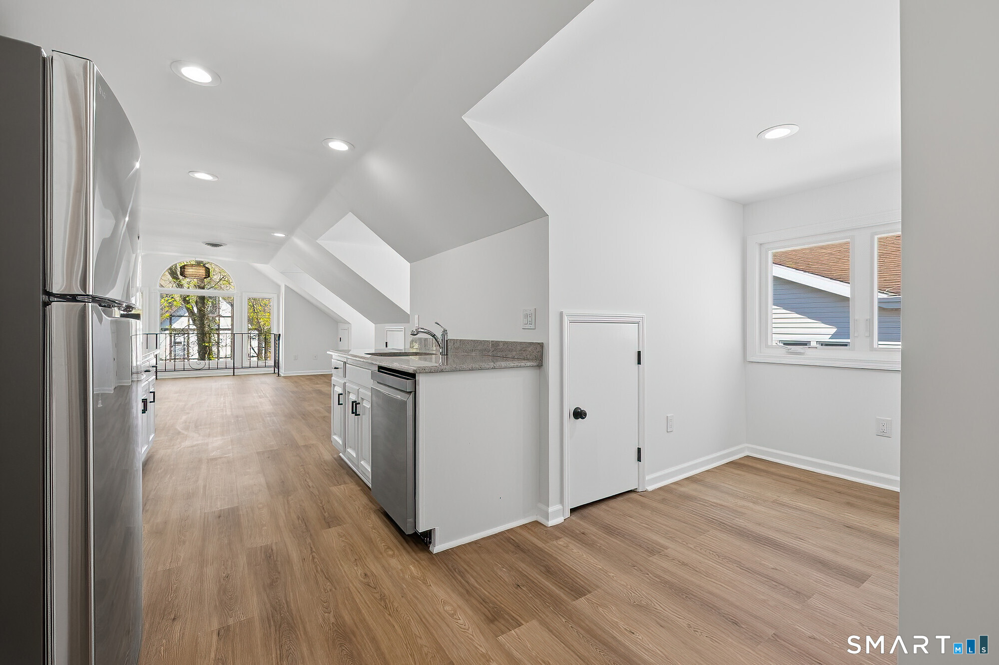 426 Main Street, Unit G Ridgefield, CT 06877 - Photo 6 of 24 a view of hallway with stairs and wooden floor