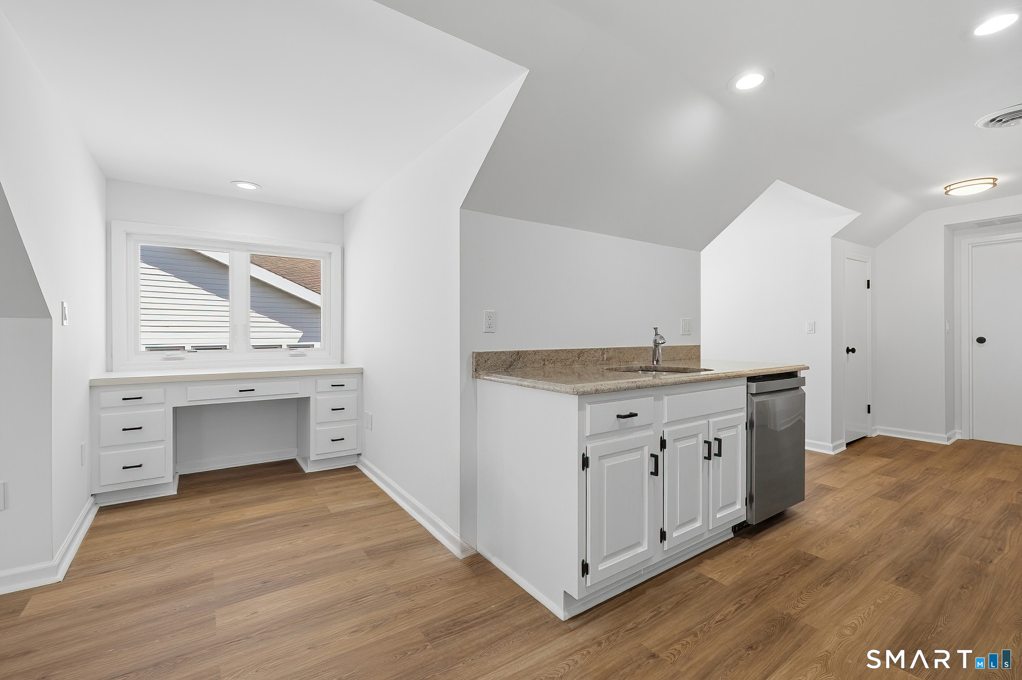 426 Main Street, Unit G Ridgefield, CT 06877 - Photo 7 of 24 a bathroom with a granite countertop sink and a mirror