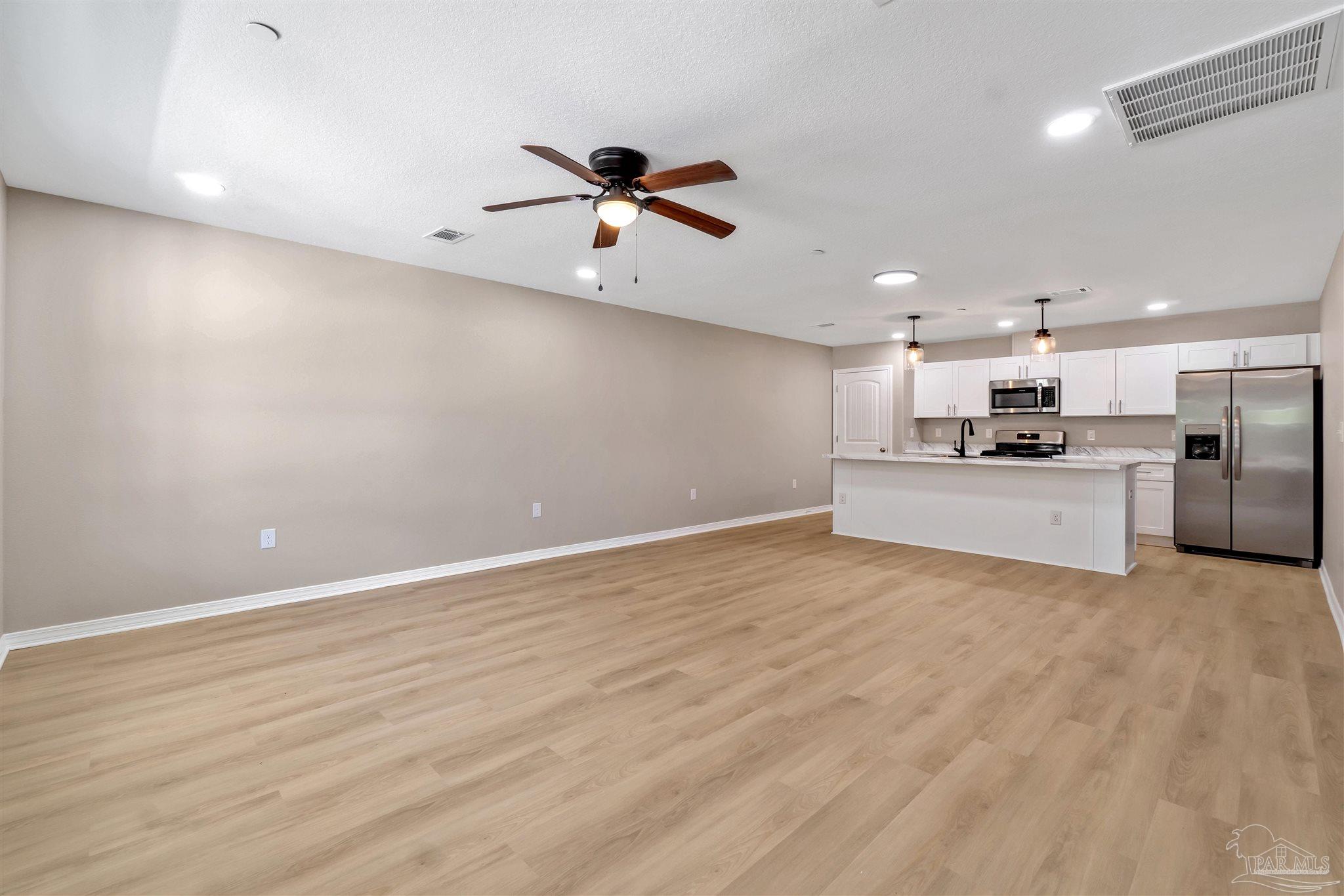50 Fulton Avenue Pensacola, FL 32503 - Photo 1 of 22 a view of a kitchen with a sink and a refrigerator