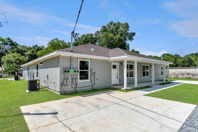a house with garden in front of it