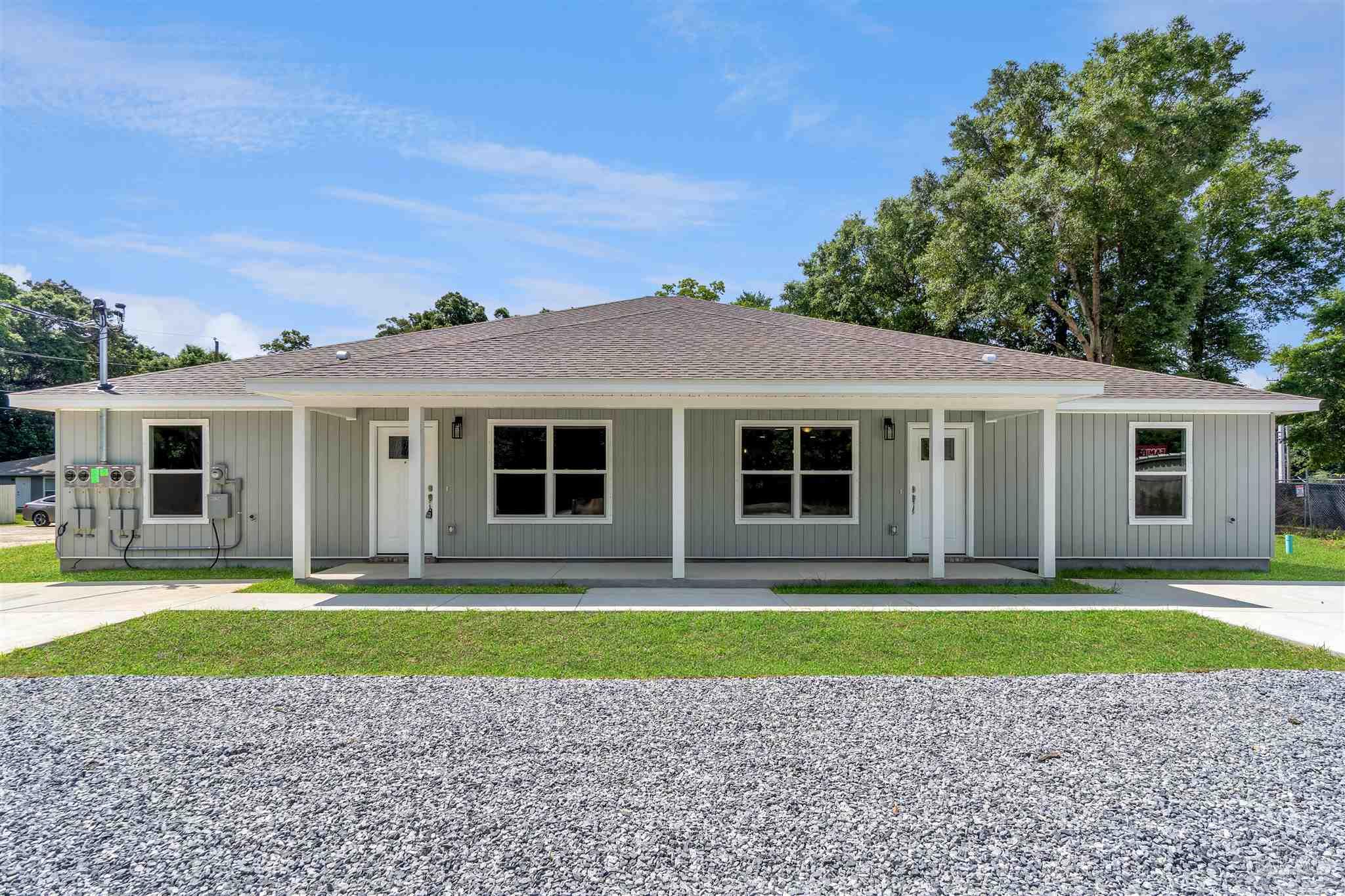 50 Fulton Avenue Pensacola, FL 32503 - Photo 19 of 22 a front view of a house with a yard and a garage