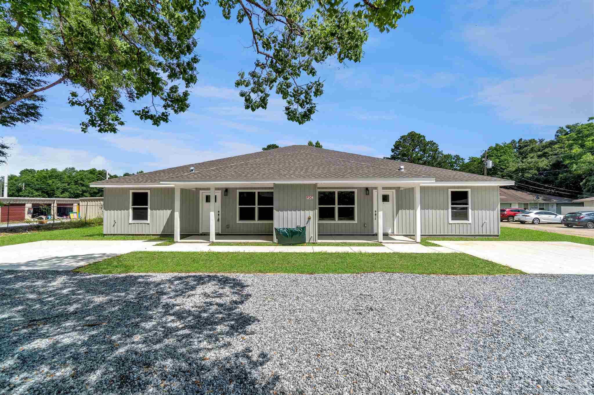 50 Fulton Avenue Pensacola, FL 32503 - Photo 21 of 22 a front view of a house with a yard and trees