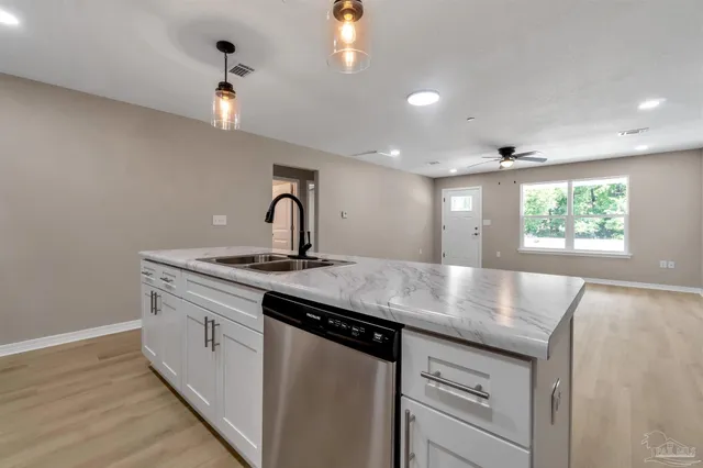 a kitchen with a sink and a window