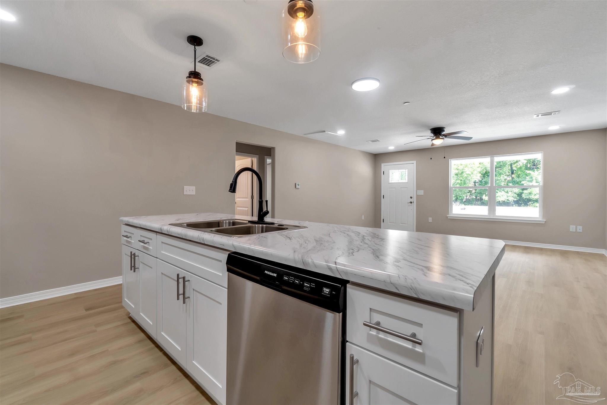 50 Fulton Avenue Pensacola, FL 32503 - Photo 10 of 22 a kitchen with a sink and a window