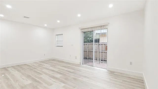 a view of entryway with wooden floor