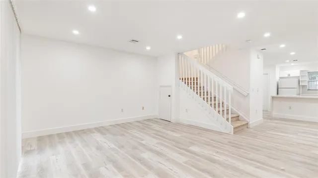 a view of entryway with wooden floor
